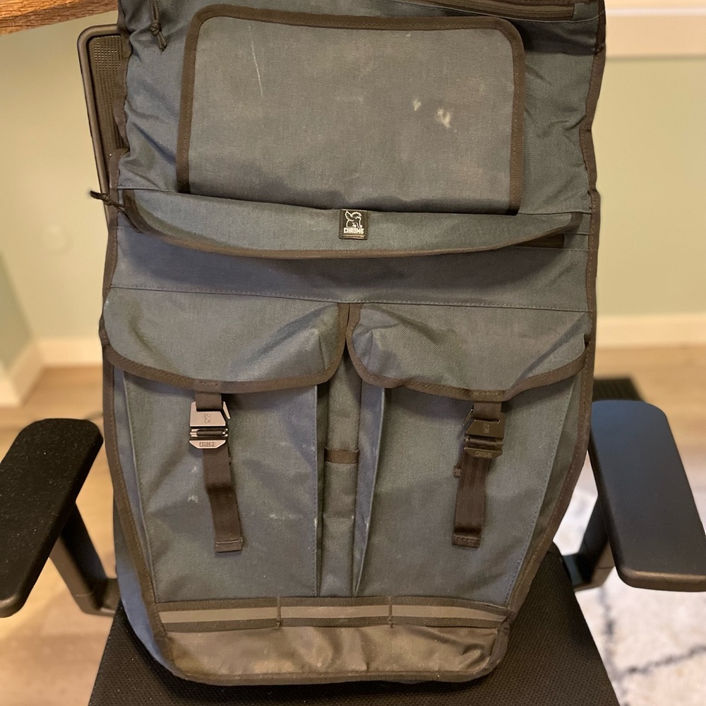 Chrome pawn roll-top backpack